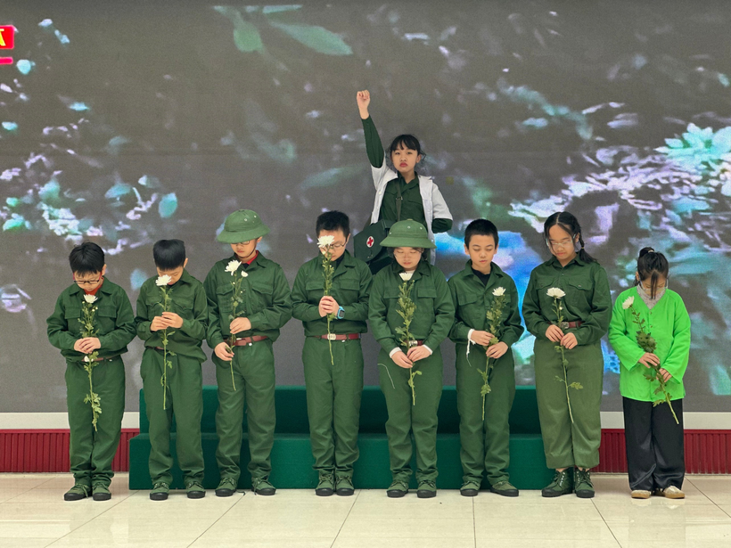 A group of people in green uniforms holding flowersDescription automatically generated
